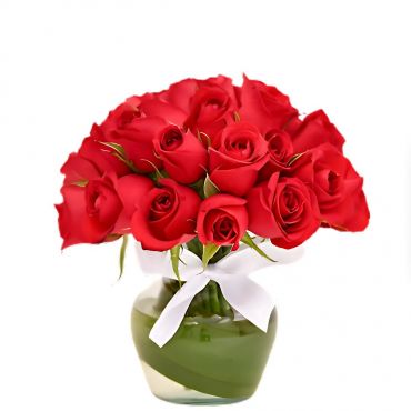 Rosas vermelhas em vaso de vidros